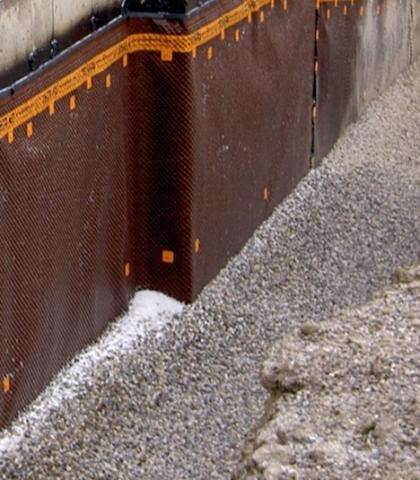 This building foundation has a drainage layer located on the exterior of the waterproofing membrane. 