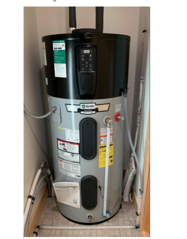 Heat pump water heater is installed in the interior closet of a multifamily dwelling unit