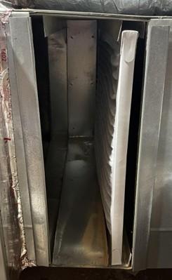This HVAC air filter slot contains a 1-inch-thick filter but the slot is designed to accept either a 1-inch or a 4-inch air filter.