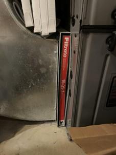 The air filter slot on this air handler has no cover.