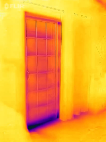 While heat loss at a glass sliding door is to be expected, the very dark area along the door in this IR camera image indicates significant heat loss that could be due to a badly aligned door, missing weather stripping, or air leakage below the door frame.