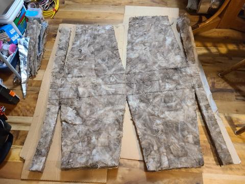 This is an example of an insulation pattern for rigid metal ducts that has been measured and cut in a comfortable location before being carried into the attic.