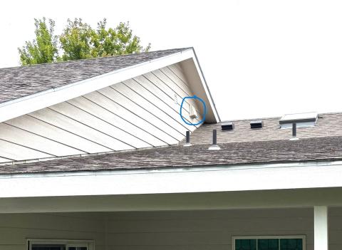 There is an exhaust duct visible in the exterior wall above the microwave exhaust fan