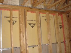 Fire-rated sealants or a fire-rated assembly air seal the tops and bottoms of the demising walls that separate one dwelling unit from another ina multifamily building