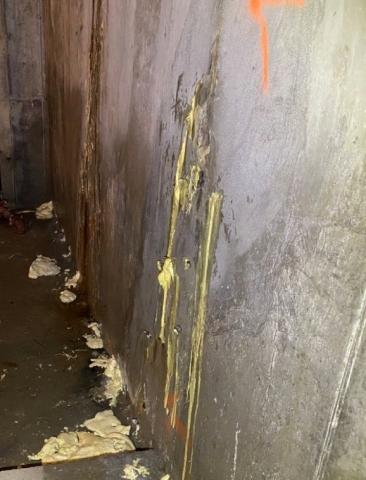 The leaks in this foundation wall have been injection sealed to prevent water infiltration into the foundation. 