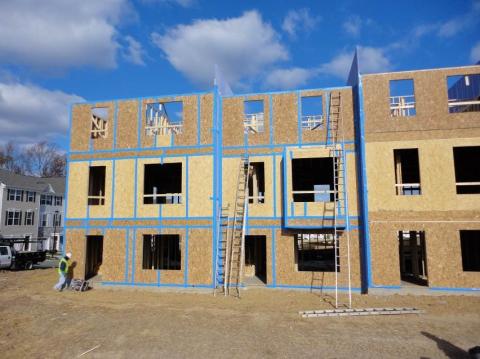 All of the sheathing seams and joints in the exterior walls of this multifamily building are air sealed with tape including the seams at the party wall interfaces