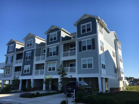These garages attached to multifamily townhouses are open to the exterior, allowing for natural air changes to remove airborne contaminants from the garage.
