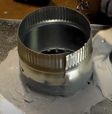 After connecting with sheet metal screws, this take-off collar is then air sealed and further secured using UL 181 fiber-reinforced duct sealant mastic paste.