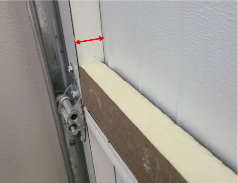 Measure the thickness of the space on the back of the garage door area where you will install the rigid foam insulation.