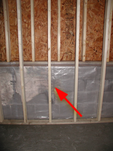Wrong - Class I vapor retarder over framed basement walls can cause condensation, mold, and rotting because plastic prevents drying to the inside; the outside should have waterproofing and vertical drainage, and the framing should be spaced from the wall.