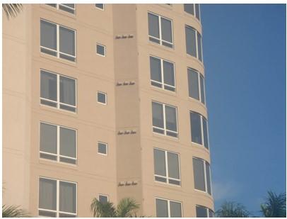 The individual exhaust systems for each dwelling unit in this multifamily building result in large numbers of penetrations in the exterior façade 