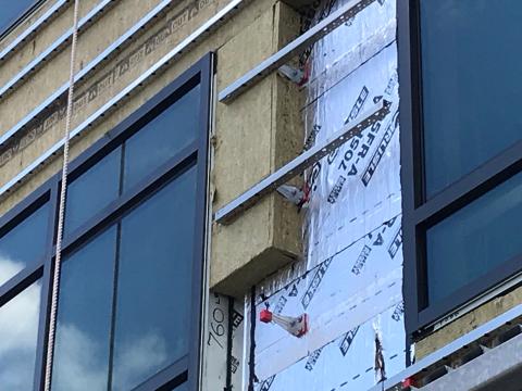 Windows are installed as “outies” in this wall assembly using a self-adhered membrane water and air control layer with continuous exterior insulation