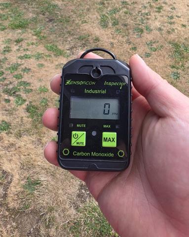 Example of a portable battery-powered carbon monoxide detector being turned on outdoors to get a zero reading before taking the detector inside the home to the location of the gas furnace.