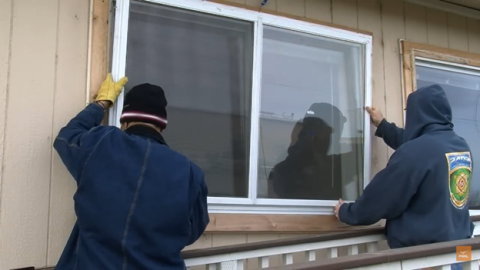 Position the storm window into opening, to ensure proper fit.