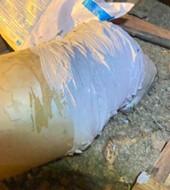 This rigid duct connection was repaired using self-piercing/self-drilling sheet metal screws to mechanically secure the connection; then it was air sealed using UL-181 fiber-reinforced duct sealant mastic paste 