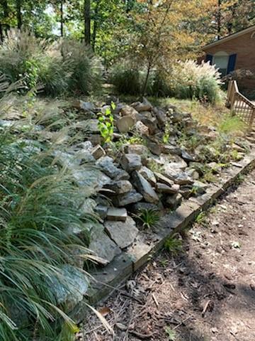 Riprap is placed on a hillside to stabilize the ground and reduce erosion