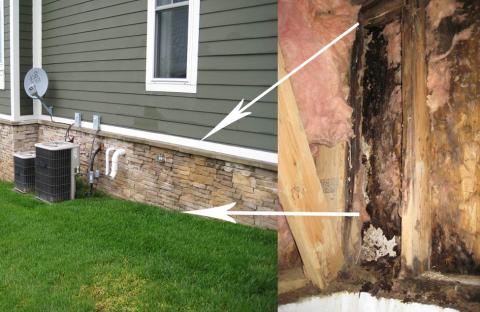 The rotting wood in this wall is the direct result of missing flashing between the lap siding and the stone wall.; water was able to soak in and rot the wood behind the stone.