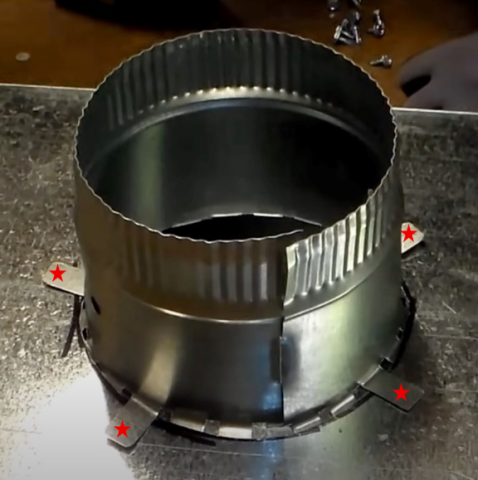 Self-piercing/self-drilling sheet metal screws are installed on the four tabs (indicated by red stars) to secure the take-off collar to the rectangular metal duct.