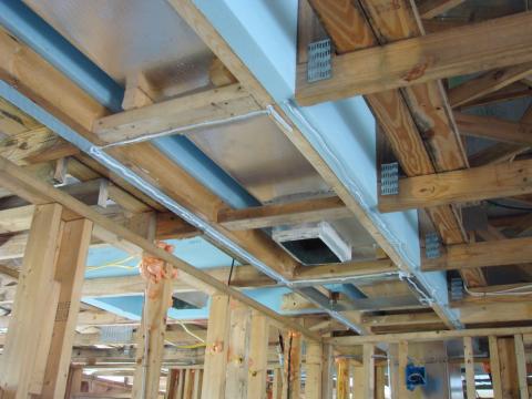Prepare chase with adhesive for bottom insulation