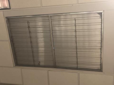 This damper located at the top of a stairwell in a multistory building is automatically kept closed to reduce energy loss; it automatically opens during a smoke event.