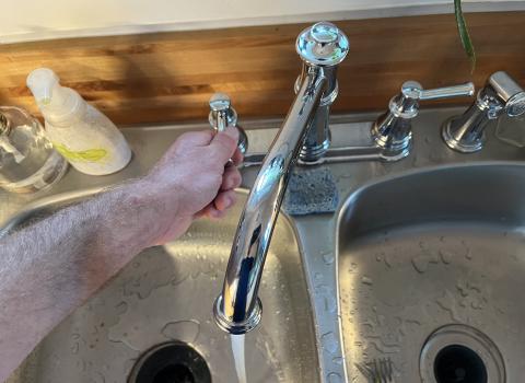 Turn a fixture on in the hot-water-only position prior to draining the water heater tank.