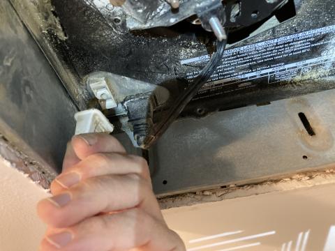 In this exhaust fan/light, both the light fixture and the fan are plugged in to the fan housing; unplug the light fixture to clean it and unplug the fan as an added precaution while cleaning the exhaust fan