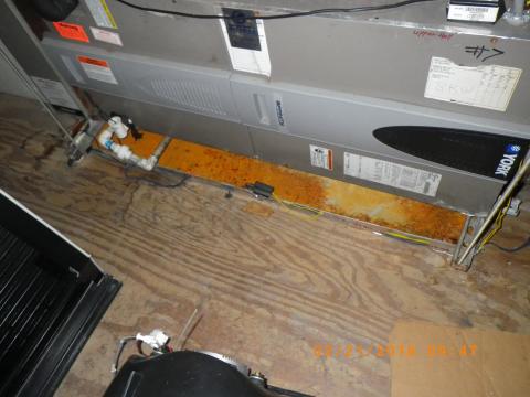 Metal drain pans under HVAC equipment can corrode over time, especially in humid environments