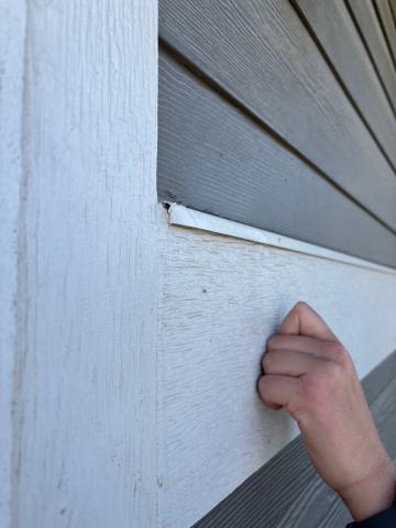 This through-the-wall flashing direct water out of the wall at this siding transition.