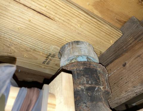 This gap around the wastewater pipe, located under a toilet on the floor above, should be air sealed with caulk or spray foam.