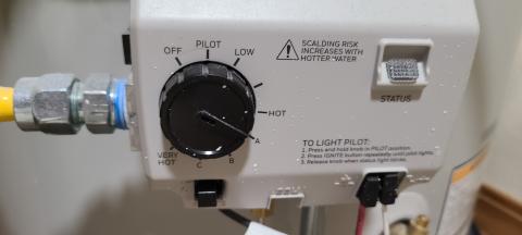 To adjust this water heater’s temperature, turn the knob on the controller; refer to the owner’s manual to determine what setting corresponds to 120°F.