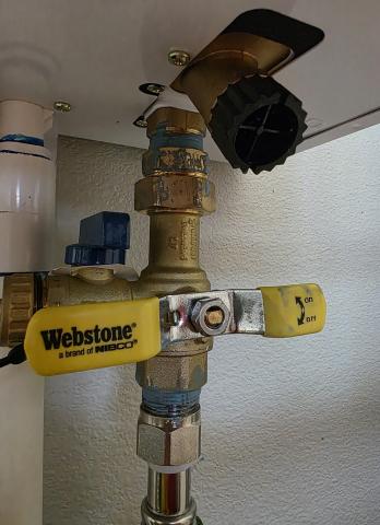 Close the water inlet valve before cleaning the water line filter on this tankless water heater