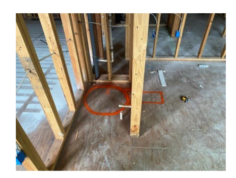 Wrong: Not enough space was left in the floorplans for both the heat pump water heater and a duct elbow to be attached to the right side of the water heater (the orange circle outlines the tank; the rectangle shows the space needed for the duct)