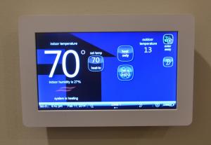 Right - The advanced controls in a programmable thermostat can be used to improve the efficiency of the home’s HVAC system.