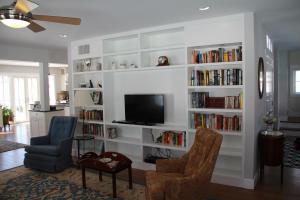 A ducted minisplit heat pump is hidden in the ceiling of this centrally located room with short duct runs to the registers located on each wall of the room.