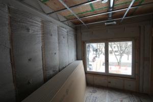 Right - a dropped ceiling below a taped plywood air barrier provides a service cavity for ducts and wiring.