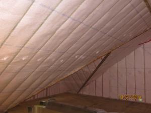 This attic was insulated with 5 inches of closed-cell spray foam on the underside of the roof deck plus 6.5 inches of blown fiberglass covered with sheetrock as a firebreak for a total R-58 roof assembly insulation value.