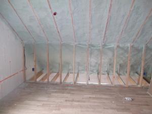 ICF walls and an attic sealed and insulated to R-63 on the underside of the roof deck with 10 inches of open‐cell spray foam plus 2.7 inches of closed‐cell spray foam provide a complete thermal break around this home. 