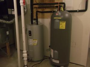 This home is equipped with an ultra-efficient (COP 5.7) ground source heat pump, which also provides domestic hot water that is stored in a tank. 