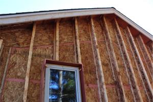 The exterior walls of this home consist of two wall cavities: a 2x6 wall with plywood sheathing plus 8-inch I-joists sheathed with engineered wood; both cavities are dense-packed with cellulose for R-60 total. 