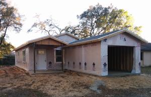 Right - Corrugated house wrap is installed over the sheathing (in this case SIPs) and overlapped and taped at all seams.