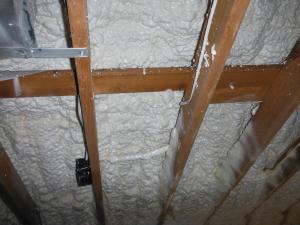 The builders sprayed the underside of the roof assembly with 6 inches of open-cell spray foam to create an unvented, R-48 insulated attic.