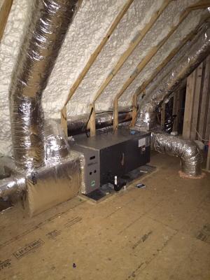 Right - Open-cell polyurethane spray foam to R-28 on underside of roof turns new attic into conditioned space for HVAC. 