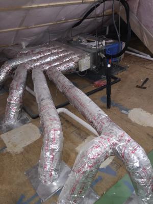 This ducted mini-split heat pump was installed in the unvented, conditioned attic and ducted with short duct runs to several nearby rooms.