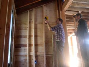 Builders use an infrared camera to “see” heat flow and air leakage around a window during construction. 