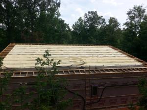 This roof was insulated above the roof deck with 5.5 inches (R-38.5) of closed-cell spray foam.  