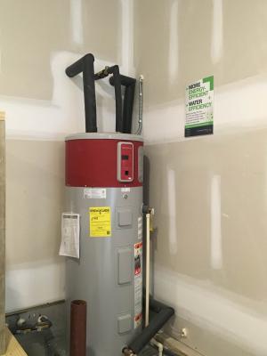 All of the pipes are insulated on this high-efficiency 50-gallon heat pump water heater. 
