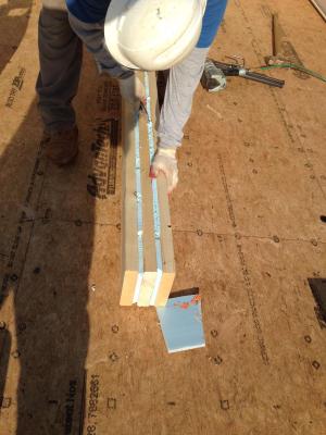 Insulated splines consisting of boards layered with rigid foam minimize energy loss at joints between the SIP wall panels. 