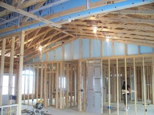 Right - These attic knee walls are insulated with rigid foam and sealed with spray foam to form a continuous air barrier at the gable end of this cathedral ceiling.
