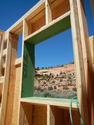 Coated sheathing is used to box the windows in this double wall.