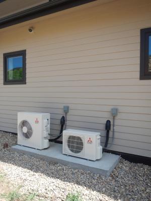 Right - Two high-efficiency (12 HSPF, 26 SEER) ductless mini-split heat pumps heat and cool the home.  